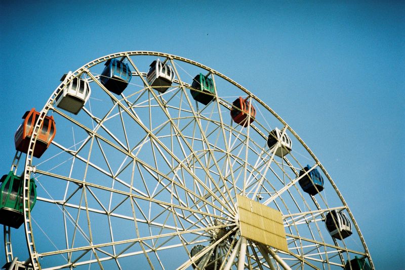 Colorful carnival ferris wheel lights at night