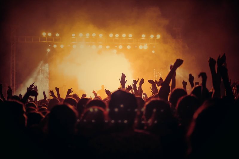 Live country music concert outdoor stage with crowd